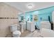 This bathroom includes a toilet, sink, and washer and dryer at 536 Ave G Se, Winter Haven, FL 33880