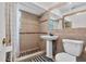 Bathroom featuring tile flooring, a walk-in shower, and modern toilet at 536 Ave G Se, Winter Haven, FL 33880
