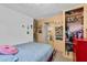 This bedroom has an open closet and a unique stone wall at 536 Ave G Se, Winter Haven, FL 33880