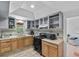 Bright kitchen featuring wood cabinets, modern appliances, and a window at 536 Ave G Se, Winter Haven, FL 33880