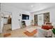 Living room with tile flooring, stone-accented walls, and ample natural light at 536 Ave G Se, Winter Haven, FL 33880