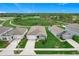 Charming single-story home with attached garage, manicured lawn, and nearby scenic walking trail at 800 Reggie Rd, Winter Haven, FL 33884