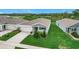 Beautiful aerial view of single-Gathering home with well-kept lawn and blue accents at 800 Reggie Rd, Winter Haven, FL 33884