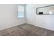 Bright bedroom features a large closet, neutral carpeting, and lots of natural light at 800 Reggie Rd, Winter Haven, FL 33884