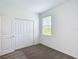 Bright bedroom featuring a closet and window, providing a comfortable and functional living space at 800 Reggie Rd, Winter Haven, FL 33884