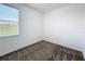 Bright and airy bedroom with a large window offering ample natural light and a cozy carpet at 800 Reggie Rd, Winter Haven, FL 33884