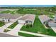 Well-maintained lawn and landscaping enhance the curb appeal of this cozy single-Gathering home at 800 Reggie Rd, Winter Haven, FL 33884