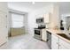 Bright, modern kitchen featuring stainless steel appliances and ample counter space at 800 Reggie Rd, Winter Haven, FL 33884