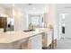 Bright and airy kitchen featuring a quartz countertop and seating for three at 800 Reggie Rd, Winter Haven, FL 33884