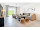 Inviting living room with plush seating, neutral tones, and abundant natural light at 800 Reggie Rd, Winter Haven, FL 33884