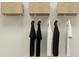 This walk-in closet features clothing hung on hangers and organized storage baskets at 1269 Deepwater Cir, Eagle Lake, FL 33839