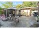 A quaint backyard with a gazebo, patio furniture, and partial fencing, creating a relaxing outdoor space at 1852 E Fern Rd, Lakeland, FL 33801