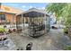 Spacious backyard featuring gazebo with pea gravel, patio, and partial fencing at 1852 E Fern Rd, Lakeland, FL 33801
