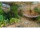 Relaxing backyard with a hammock, gravel, rock and trellis, creating a relaxing outdoor oasis at 1852 E Fern Rd, Lakeland, FL 33801