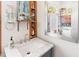 Bathroom vanity showcasing marble countertop, stylish faucet, and large mirror reflecting natural light at 1852 E Fern Rd, Lakeland, FL 33801