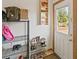 Functional foyer with a shoe rack and storage for bags, conveniently located near the front door at 1852 E Fern Rd, Lakeland, FL 33801