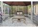 Gazebo featuring a wrought iron table, seating, pea gravel, and lattice fencing at 1852 E Fern Rd, Lakeland, FL 33801