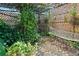 A tranquil backyard hammock area with lush greenery, creating a private outdoor oasis at 1852 E Fern Rd, Lakeland, FL 33801