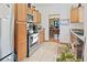 Functional kitchen with tile floors, stainless steel appliances and oak cabinets at 1852 E Fern Rd, Lakeland, FL 33801