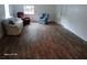 Spacious living room with hardwood floors and natural light at 2212 Ne 11 Ct, Ocala, FL 34470
