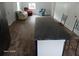 Open-concept space with a kitchen island extending to the living area with chairs and sofa at 2212 Ne 11 Ct, Ocala, FL 34470