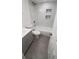 Bathroom featuring shower/tub combo with marble tile and dark grey tiled floors at 312 Dorothy Ave, Daytona Beach, FL 32117
