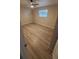 Cozy bedroom with updated flooring, a ceiling fan, and a window for natural light at 312 Dorothy Ave, Daytona Beach, FL 32117