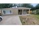 Charming single-story home with a neutral color scheme and a small front porch area at 312 Dorothy Ave, Daytona Beach, FL 32117