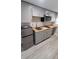 Modern kitchen area featuring a stainless steel refrigerator, updated cabinets, and wooden countertops at 312 Dorothy Ave, Daytona Beach, FL 32117