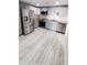 Updated kitchen boasts stainless steel appliances, modern countertops and stylish grey cabinetry at 312 Dorothy Ave, Daytona Beach, FL 32117
