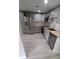 Well-appointed kitchen featuring stainless steel appliances, light grey cabinets, and modern countertops at 312 Dorothy Ave, Daytona Beach, FL 32117