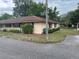 Exterior view of a well-maintained home with manicured landscaping and a tidy lawn at 42 Villa Villar Ct # 420, Deland, FL 32724