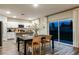 Open-concept dining area with modern decor, a sliding glass door, and kitchen access at 1629 Sage Ave, Haines City, FL 33844