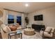 Cozy living room with a comfortable sofa, stylish decor, and natural light at 1629 Sage Ave, Haines City, FL 33844