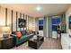 Living room featuring comfortable seating, modern decor, and a home theater setup at 1629 Sage Ave, Haines City, FL 33844