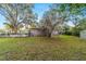 Spacious backyard with lush green grass and shed at 208 Se 32Nd Ave, Ocala, FL 34471