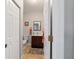 Half bath features a wooden vanity and tile floor at 208 Se 32Nd Ave, Ocala, FL 34471