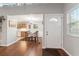 Bright dining area features hardwood floors, wainscotting and is adjacent to the kitchen and living areas at 208 Se 32Nd Ave, Ocala, FL 34471