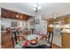 Open concept dining and living room featuring hardwood floors and a wood plank ceiling at 208 Se 32Nd Ave, Ocala, FL 34471