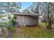 Side of the home with a compact air conditioning unit at 208 Se 32Nd Ave, Ocala, FL 34471