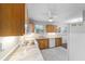 Eat-in kitchen with stainless steel sink, marble countertops and a window for natural light at 208 Se 32Nd Ave, Ocala, FL 34471