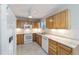 Bright kitchen featuring marble tile floors, wood cabinets, and new appliances at 208 Se 32Nd Ave, Ocala, FL 34471