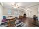 Spacious living area features wood floors, ceiling fans, and access to other rooms at 208 Se 32Nd Ave, Ocala, FL 34471