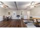 Spacious living area features wood floors, ceiling fans, and access to other rooms at 208 Se 32Nd Ave, Ocala, FL 34471
