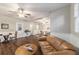 Open concept living room featuring hardwood floors and multiple seating areas at 208 Se 32Nd Ave, Ocala, FL 34471