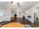 Spacious living area features wood floors, ceiling fans, and access to other rooms at 208 Se 32Nd Ave, Ocala, FL 34471