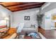 Charming living room with hardwood floors, clerestory windows, wood-clad ceilings, and a view into the kitchen at 208 Se 32Nd Ave, Ocala, FL 34471