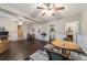 Spacious living area features wood floors, ceiling fans, and access to other rooms at 208 Se 32Nd Ave, Ocala, FL 34471
