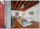 Cozy living room with wood ceiling, fireplace, and hardwood floors at 208 Se 32Nd Ave, Ocala, FL 34471
