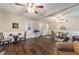 Spacious living area features wood floors, ceiling fans, and access to other rooms at 208 Se 32Nd Ave, Ocala, FL 34471